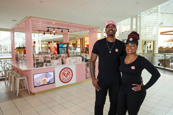 Ludacris’ official DJ Calvin “Infamous” Donald and his wife, Ashanta Donald, are pictured in front of their kiosk Panda Pancakes near the food court at the North Point Mall, Thursday, November 7, 2024, in Alpharetta, Ga. Ashanta is shown right. (Jason Getz / AJC)
