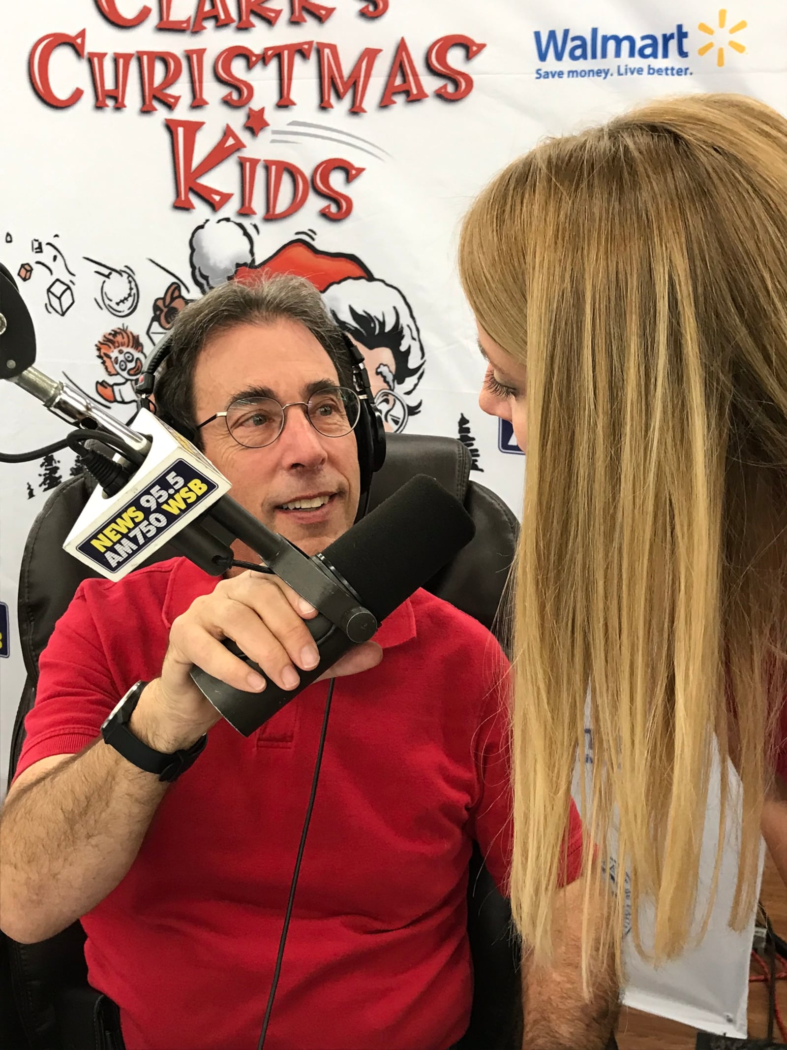 Clark Howard brought his daughter Rebecca (who recently joined his company) to the mic to talk about how she grew up thinking the Dollar Store was the toy store. She recently paid off her car and is debt free, a lesson she learned from her dad. CREDIT: Rodney Ho/rho@ajc.com.