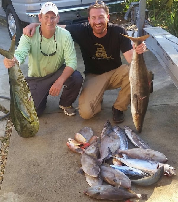 Brandon Barfield, left, with his best friend, Drew DeVoursney, whose murder last year in Belize remains unsolved. “He was my brother,” Barfield said. “I think about him every day.”