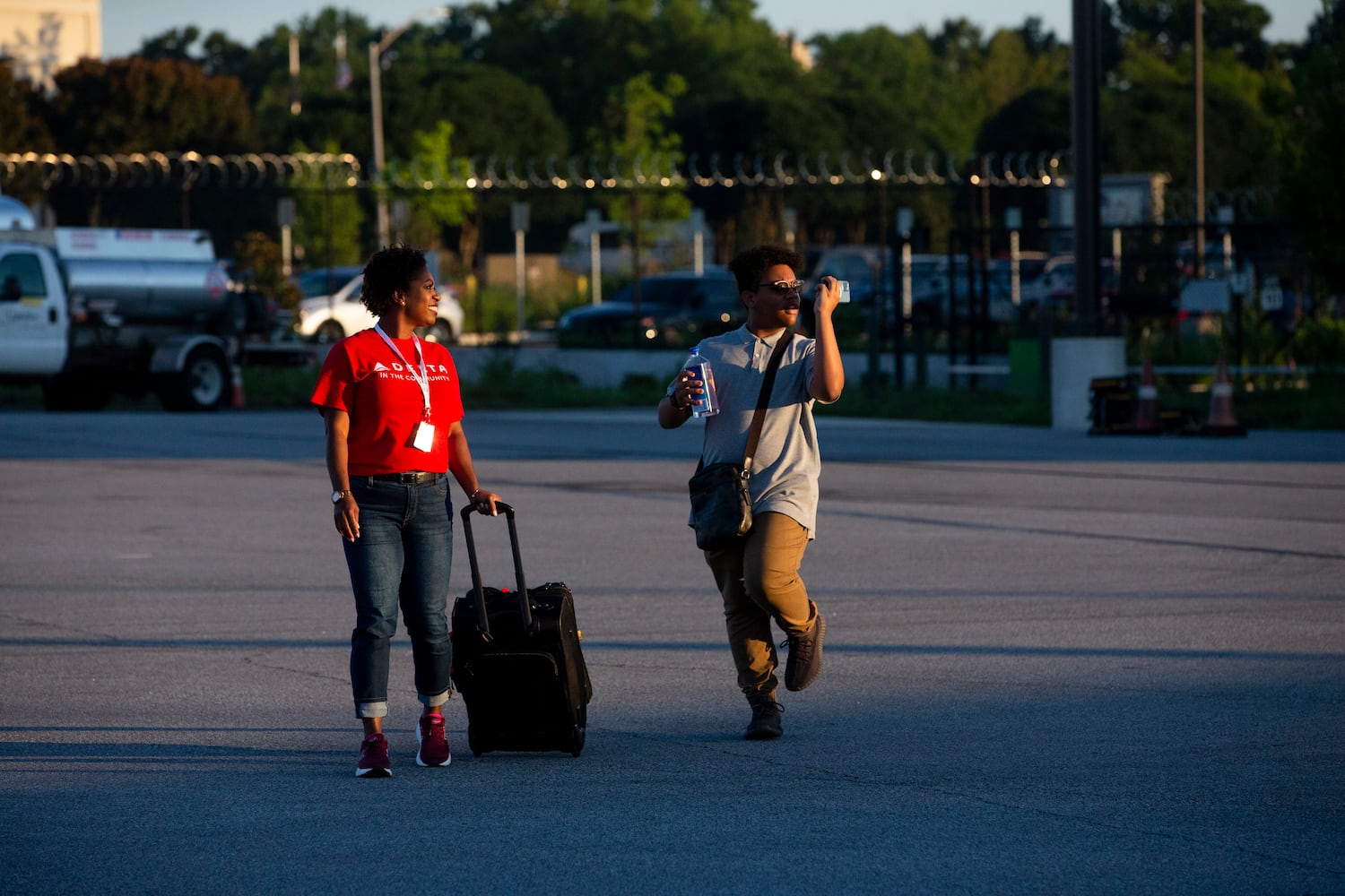 Participants of Delta’s Dream Flight 2022 event walk out to the runway to board a plane at Hartsfield-Jackson Atlanta International Airport on Friday, July 15, 2022. Around 150 students ranging from 13 to 18 years old will fly from Atlanta to the Duluth Air National Guard Base in Duluth, Minnesota. (Chris Day/Christopher.Day@ajc.com)