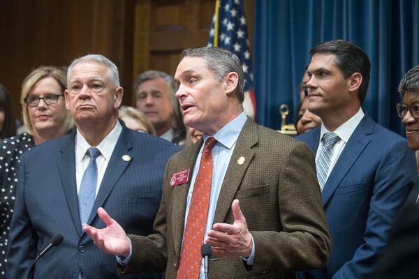 Georgia Speaker of the House David Ralston (left) and Georgia Lieutenant Governor Geoff Duncan (right) listen as Georgia Representative Ed Setzler (center) thanks his supporters during a press conference for the signing of HB 481 in the Governor’s office at the Georgia State Capitol building on May 7. (ALYSSA POINTER/ALYSSA.POINTER@AJC.COM)