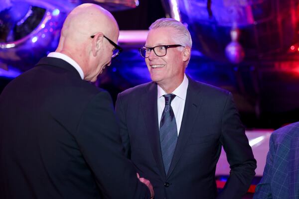 Delta CEO Ed Bastian (right) greets a staff member during the 2024 Delta Chairman’s Club Gala at the Delta Flight Museum on Thursday, Nov. 21, 2024, in Atlanta. Deregulation “democratized” the skies, as Bastian described it, calling the change an “incredible positive force.” (Jason Getz/AJC 2024)