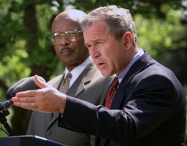 President Bush, right, speaks during the teacher of the year award ceremony in the Rose Garden of the White House as Secretary of Education Rod Paige, left, listens Monday, April 23, 2001, in Washington. (AP Photo/Pablo Martinez Monsivais) Former President Bush and his-then Secretary of Education Rod Paige, left, talked to the press about education in 2001. (AP Photo)