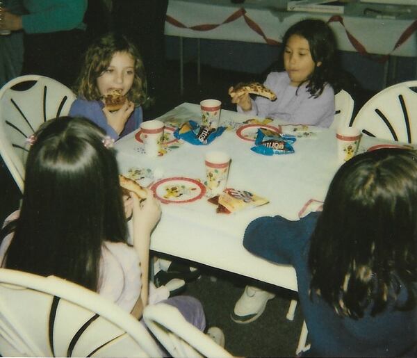 Olivia King and guests at her eighth birthday party enjoy pizza at the former Suburban Lanes bowling alley in Decatur. (Courtesy of the King family)