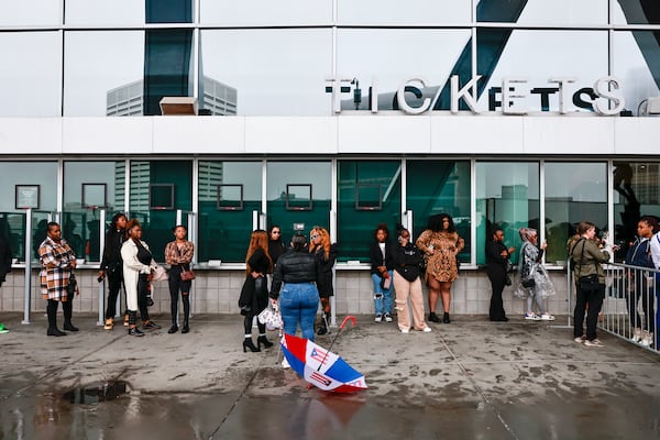 Fans wait outside of State Farm Arena to attend the memorial service for Migos rapper Takeoff on Friday, November 11, 2022. (Natrice Miller/natrice.miller@ajc.com)  