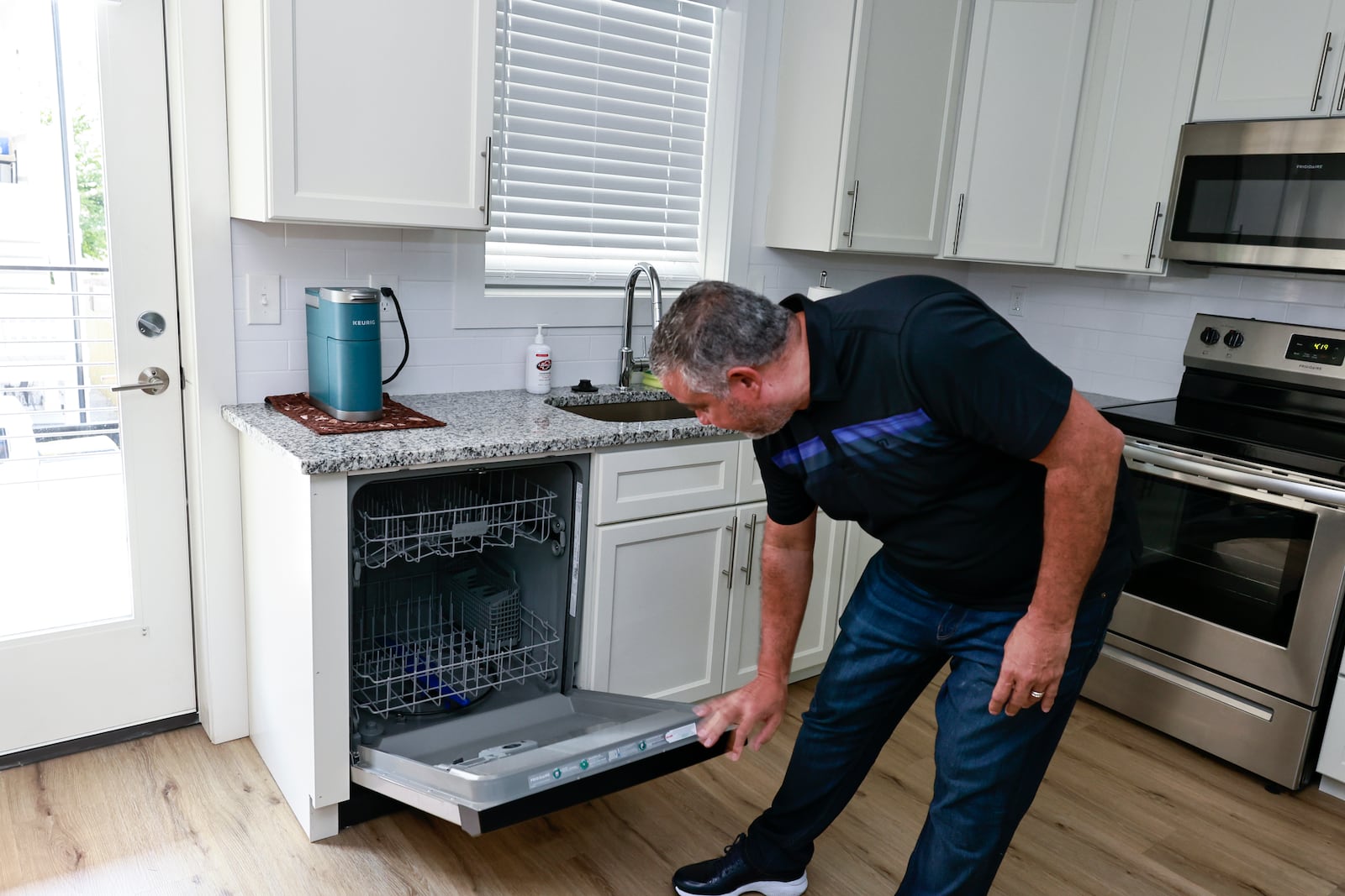 Rich Munroe does a final inspection of his Midtown rental property after it has been cleaned on Tuesday, July 26, 2022. (Natrice Miller/natrice.miller@ajc.com)