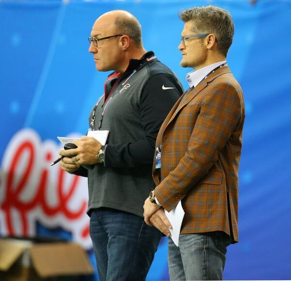 Falcons general manager Thomas Dimitroff and assistant general manager Scott Pioli were spotted together on the sidelines evaluating players during the Chick-fil-A Peach Bowl on Wednesday, Dec. 31, 2014, in Atlanta. It's not clear if Pioli, who has a larger role in the draft, will be made available to the local media leading up to the draft. (Curtis Compton/CCompton@ajc.com)