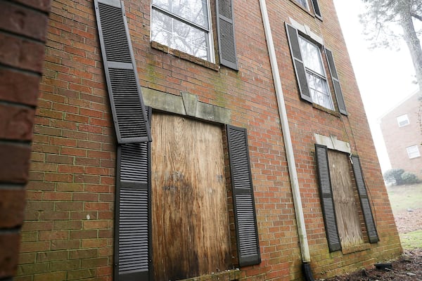 Apartment windows are boarded up at Parkview Apartments, located at 360 Riverside Parkway, in Austell, Thursday, February 21, 2019. ALYSSA POINTER/ALYSSA.POINTER@AJC.COM