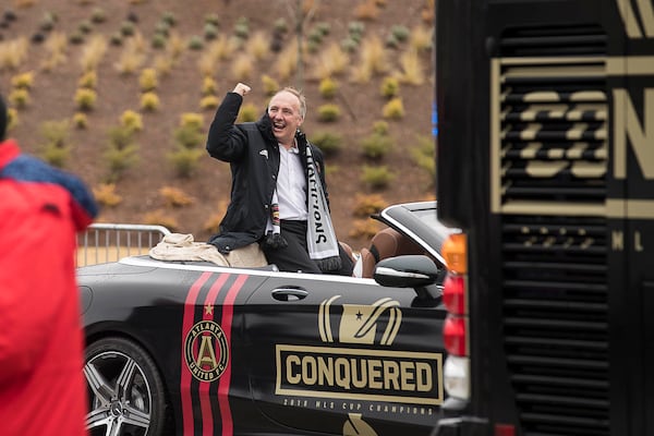 12/10/2018 -- Atlanta, Georgia -- Atlanta United president Darren Eales waves at fans at the tail end of the victory parade while entering the Home Depot Backyard Lot, Monday, December 10, 2018. The Atlanta United became the second major league team in Georgia to win a championship title. The Atlanta United beat the Portland Timbers during the MLS Championship that was hosted at Mercedes-Benz Stadium, Saturday, December 8. (ALYSSA POINTER/ALYSSA.POINTER@AJC.COM)