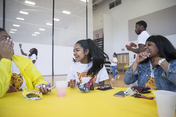 Marisela (center) talks with her friends Victoria Thach (left) and Dayjah Littlejohn (right) during the senior picnic at Maynard Jackson High School in Atlanta. ALYSSA POINTER/ATLANTA JOURNAL-CONSTITUTION