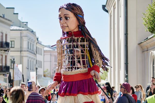 A crowd in Lublin, Poland walks with Little Amal on her journey through some 97 towns and cities in 15 countries.
(Courtesy of The Walk Productions)