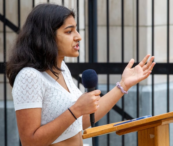 Decatur High School student Yana Batra talks to the crowd near the Capitol on to protest legislation that would control classroom discussions about race Feb. 25, 2022.  (STEVE SCHAEFER FOR THE ATLANTA JOURNAL-CONSTITUTION)