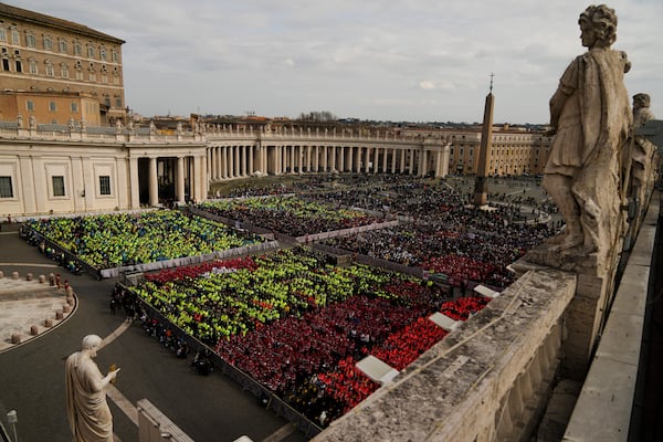 Members of different organizations of volunteers follow Cardinal Michael Czerny, delegate of Pope Francis who is being treated for pneumonia at Rome's Agostino Gemelli Polyclinic, celebrating a mass for the world of volunteers in St. Peter's Square at The Vatican, Sunday, March 9, 2025. (AP Photo/Francisco Seco)