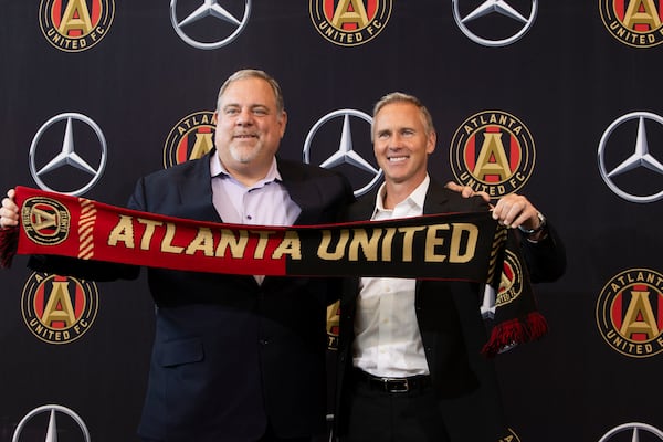 Chris Henderson (right), the newly appointed chief soccer officer and sporting director of Atlanta United, and Garth Lagerwey (left), president and chief executive officer of Atlanta United, pose for a photo during a press conference introducing Henderson as the new technical director on Tuesday, December 17, 2024, at the Atlanta United training grounds in Marietta, Georgia. CHRISTINA MATACOTTA FOR THE ATLANTA-JOURNAL CONSTITUTION.


