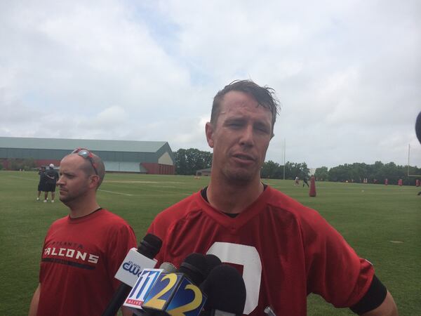 Falcons quarterback Matt Ryan giving up an update on the implementation of the new offense. (D. Orlando Ledbetter/dledbetter@ajc.com)