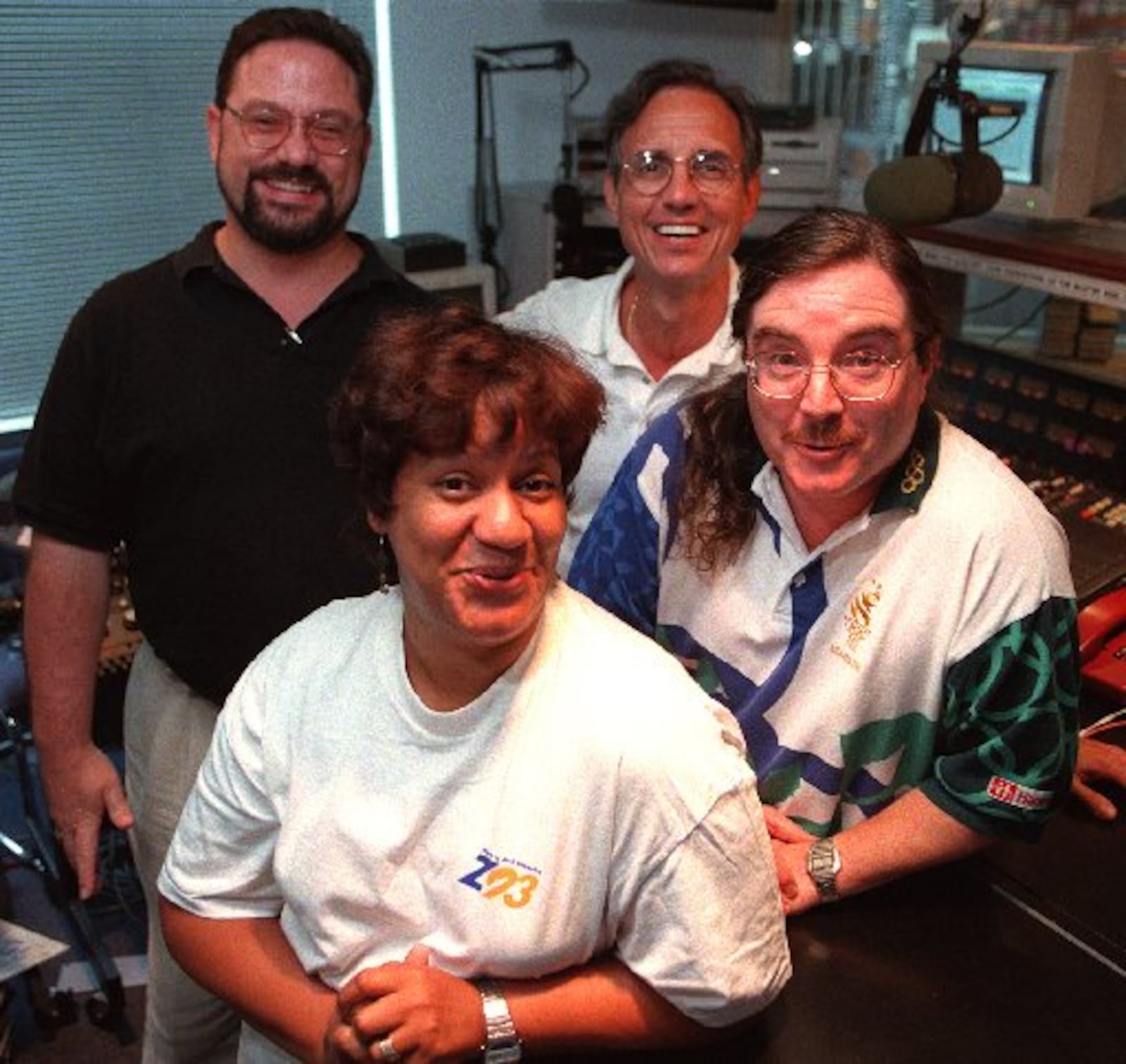 Longtime Atlanta deejay 'Willard' (right front) poses with his new co-workers (clockwise from him) Marcia Shipley, Art Mehring & Gary McKee at the Z93 studios in 1996. (PHIL SKINNER /AJC staff).