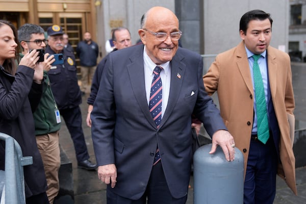 Rudy Giuliani speaks to reporters as he leaves the federal courthouse in New York, Tuesday, Nov. 26, 2024. (AP Photo/Seth Wenig)