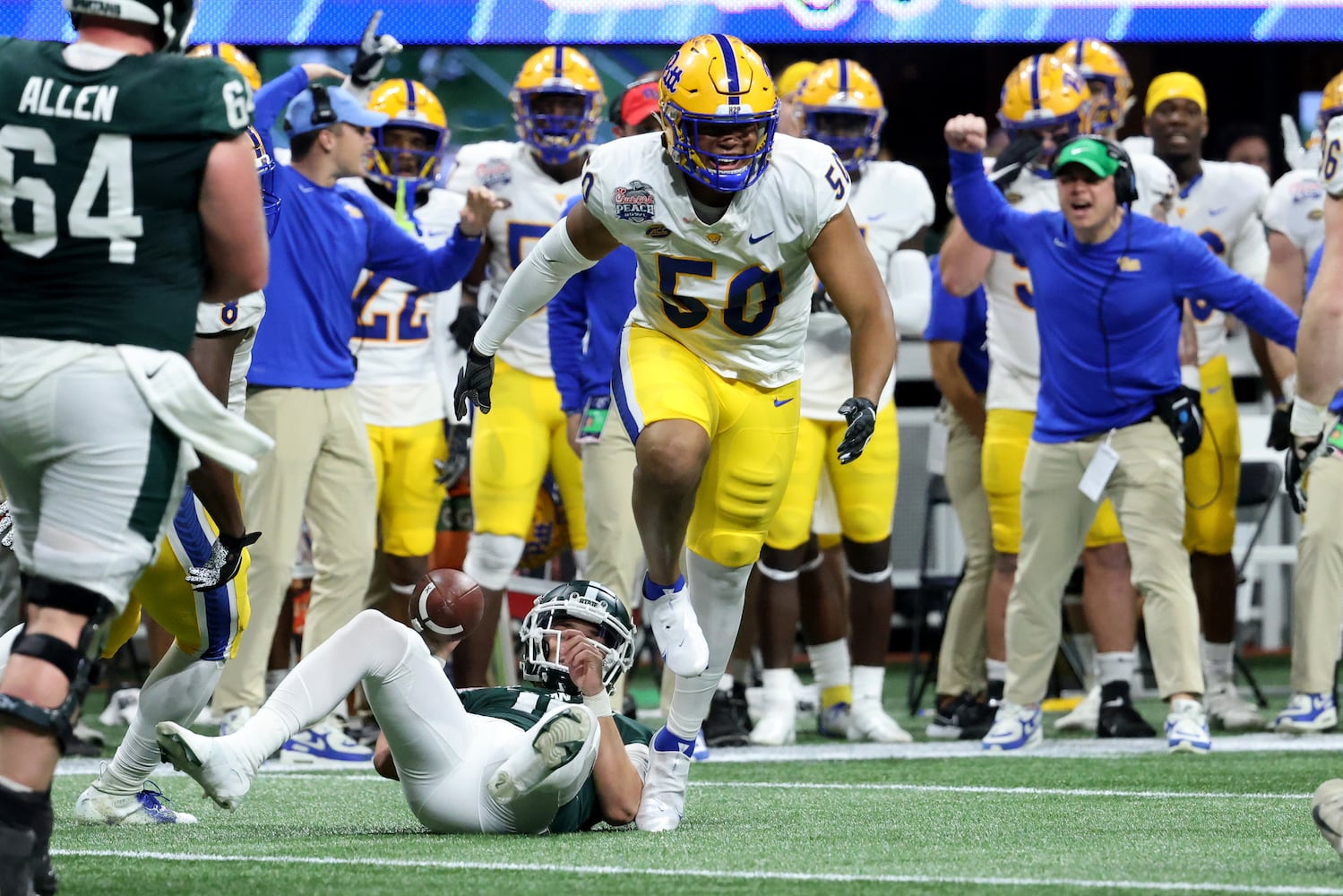 Pittsburgh Panthers defensive lineman Dayon Hayes (50) reacts after sacking Michigan State Spartans quarterback Payton Thorne (10) during the first half of the Chick-fil-A Peach Bowl at Mercedes-Benz Stadium in Atlanta, Thursday, December 30, 2021. JASON GETZ FOR THE ATLANTA JOURNAL-CONSTITUTION