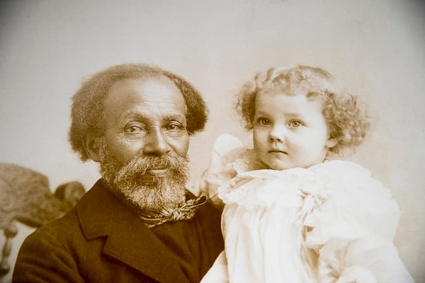 A rare photograph of a black male caregiver is displayed inside the ‘Framing Shadows’ exhibit at Emory University. Most of the photos she selected for “Framing Shadows” are from the 19th century, pre-Civil War. Others span from Reconstruction up to 1920.