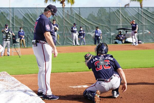 Braves catching coach Sal Fasano (left) works with catcher Shea Langeliers during workouts Friday, Feb. 19, 2021, at the team facility North Port, Fla. (Bill Willias/Atlanta Braves)