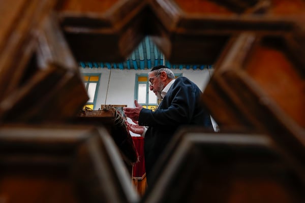 FILE - Rabbi Yusuf Hamra prays at the al-Franj synagogue where he used to serve as a rabbi in the old city of Damascus, Feb. 18, 2025. (AP Photo/Omar Sanadiki, File)