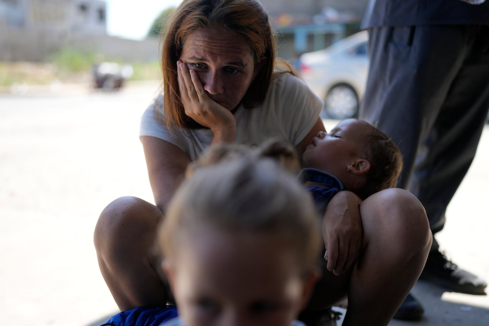 Venezuelan migrant Erika Arias waits with her family outside a shelter in Tapachula, Mexico, Sunday, Oct. 27, 2024. (AP Photo/Matias Delacroix)