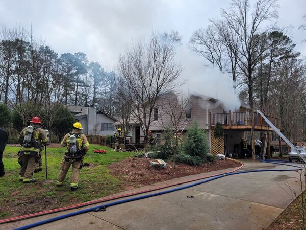 Neighbors, loved ones and firefighters worked together to rescue the man from the second story of the home.