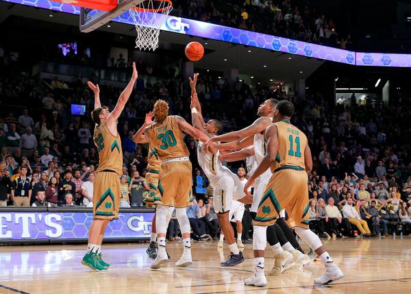 Georgia Tech guard Marcus Georges-Hunt (3) shoots the winning basket in the final seconds of an NCAA college basketball game against Notre Dame in Atlanta, Saturday, Feb. 20, 2016. Georgia Tech won 63-62. (AP Photo/Todd Kirkland)