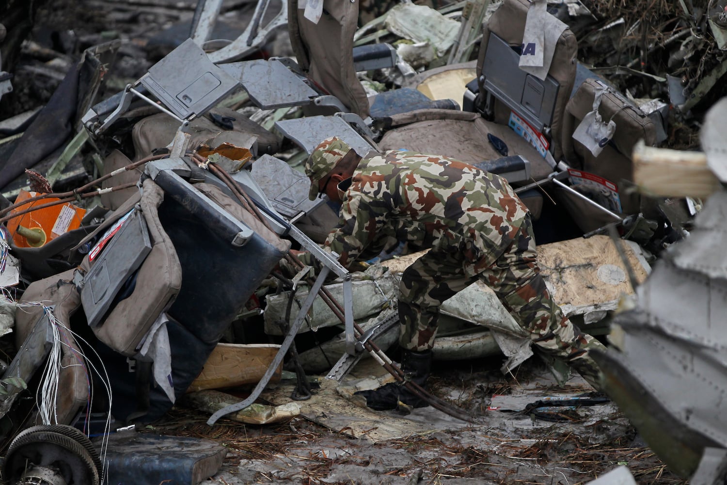 Photos: Kathmandu plane crash kills dozens, Nepal police say