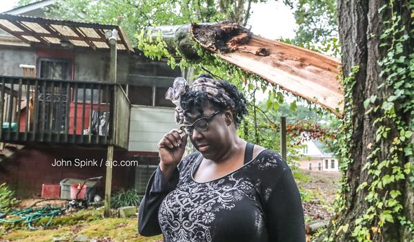 Sharon Tarver said a 100-year-old oak tree came down on her bedroom right as she was falling asleep Monday night. 