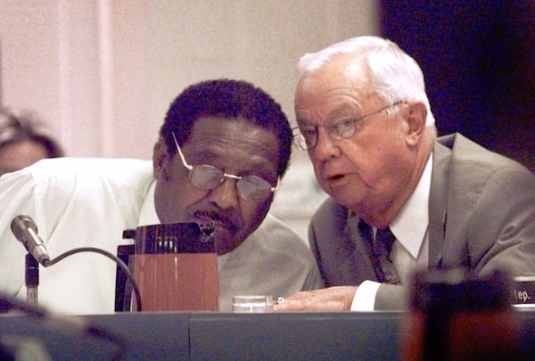 FILE - House Appropriations Chairman Charlie Capps, D-Cleveland, right, and Speaker Pro-Tem Robert Clark, D-Lexington, review departmental budgets Sept. 8, 1999 in Jackson, Miss. (AP Photo/Rogelio Solis, File)