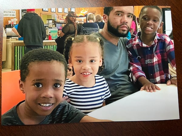 Dominique Sanjurjo with his three children. 