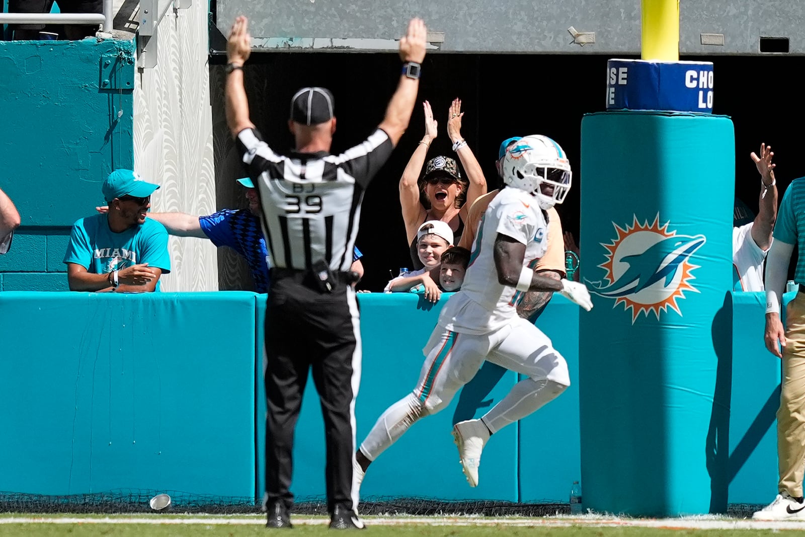 Miami Dolphins wide receiver Tyreek Hill (10) scores a touchdown during the second half of an NFL football game against the Jacksonville Jaguars, Sunday, Sept. 8, 2024, in Miami Gardens, Fla. (AP Photo/Rebecca Blackwell)