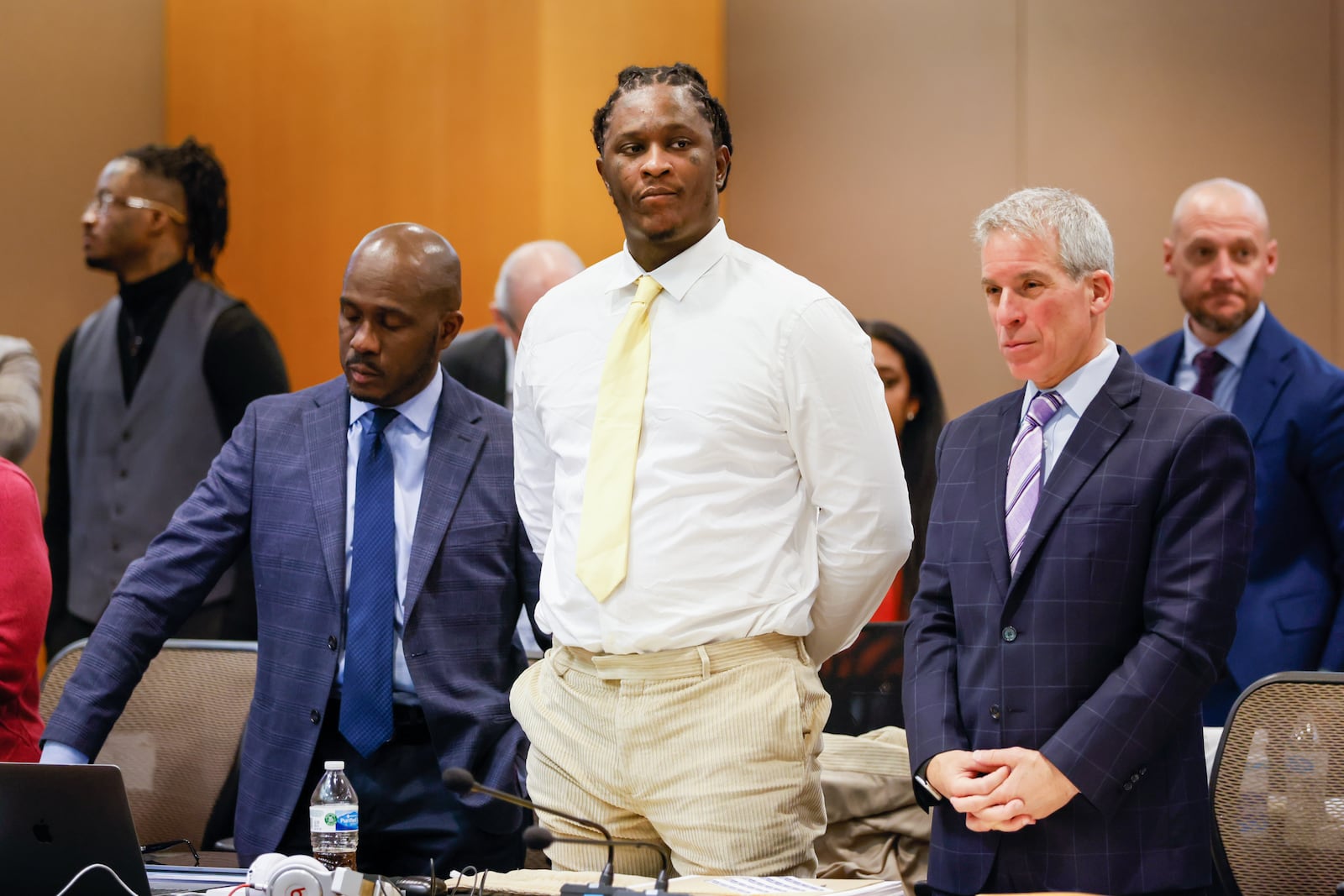 Atlanta rapper Young Thug (center) stands with his attorneys during his ongoing gang and racketeering trial at Fulton County Courthouse in Atlanta on Wednesday, January 3, 2024. (Arvin Temkar / arvin.temkar@ajc.com)