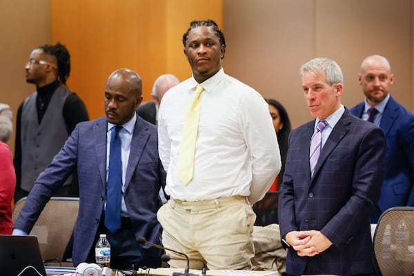 Atlanta rapper Young Thug (center) stands with his attorneys during his ongoing gang and racketeering trial at Fulton County Courthouse in Atlanta on Wednesday, January 3, 2024. (Arvin Temkar / arvin.temkar@ajc.com)