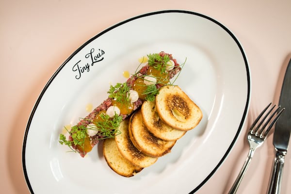  Beef Tartare with arugula, capers, mustard oil, thyme, whipped marrow, charred onion, egg yolk, and brioche. Photo credit- Mia Yakel.