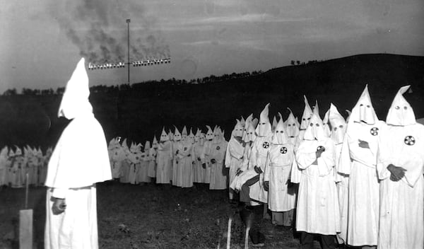 At an initiation ceremony for 700 members, the Ku Klux Klan burns a huge cross on Stone Mountain on July 23, 1948. Said one historian: “Atlanta was the headquarters of the revived KKK; we sold it around the nation like it was Coca-Cola.” (Associated Press file)