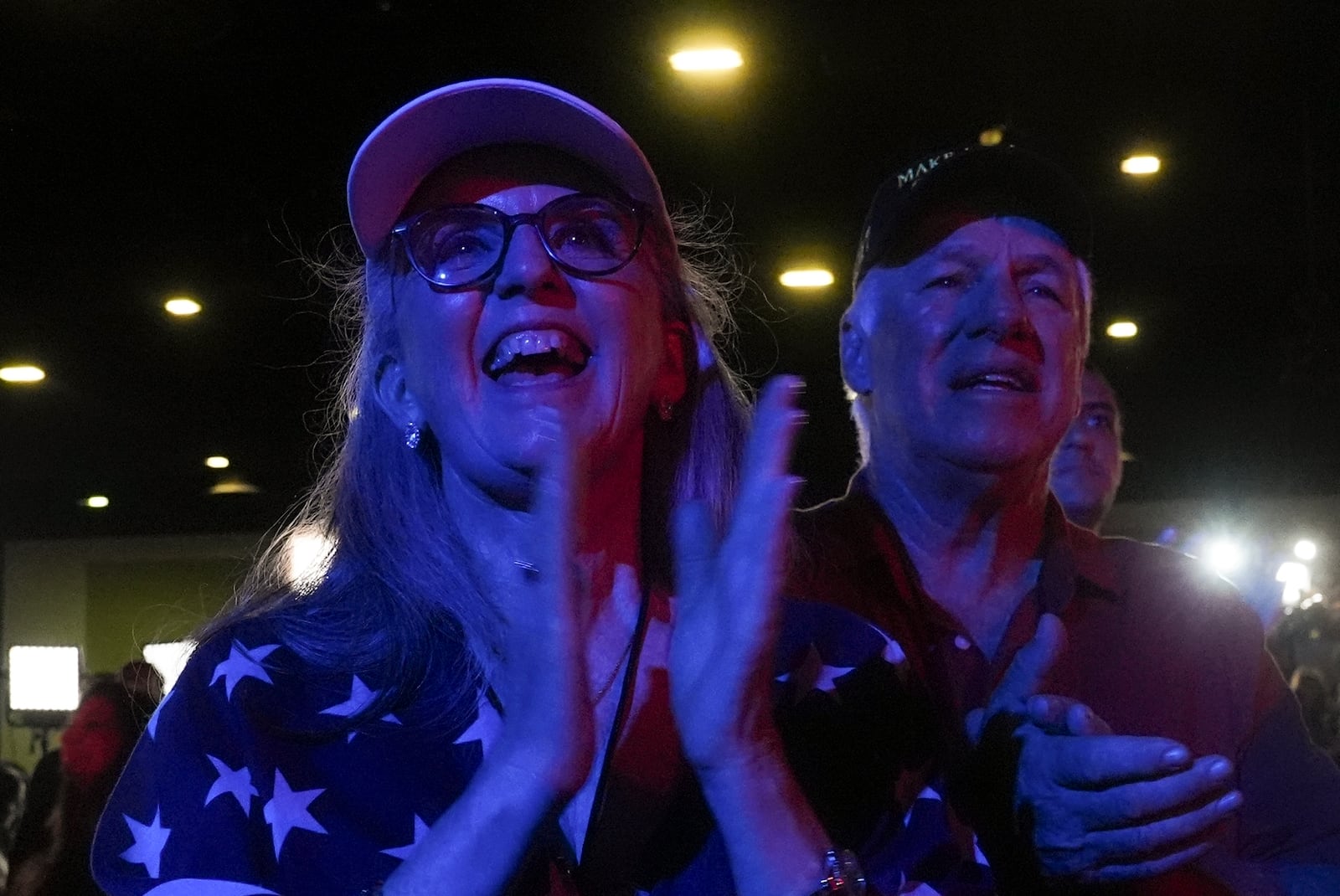 Supporters of Republican presidential nominee former President Donald Trump react as he speaks at an election night watch party, Wednesday, Nov. 6, 2024, in West Palm Beach, Fla. (AP Photo/Marta Lavandier)