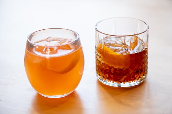 The Abby Singer cocktails Naked and Famous (left) and Pemberton Olde Fashioned (right). (Mia Yakel for The Atlanta Journal-Constitution)