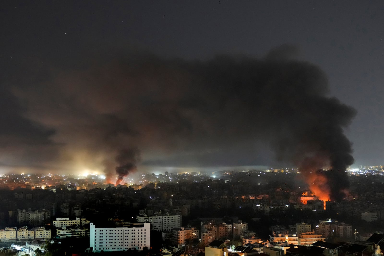 Flame and smoke rises from Israeli airstrikes on Dahiyeh, in the southern suburb of Beirut, Lebanon, early Sunday, Oct. 27, 2024. (AP Photo/Hussein Malla)