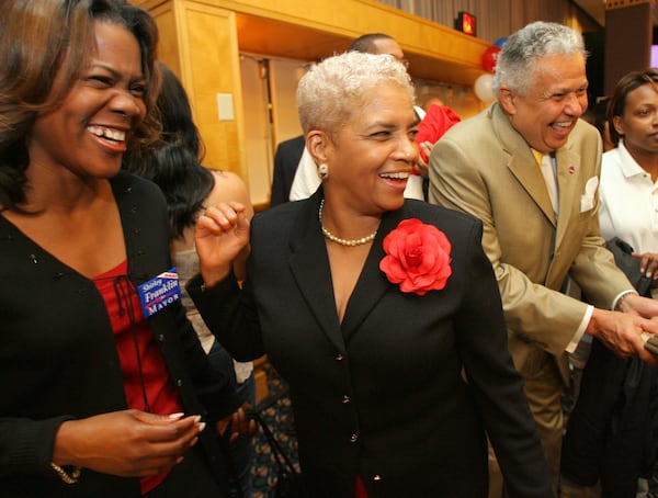 Mayor Shirley Franklin (center) celebrates with campaign workers Candace Byrd (left) and Aaron Turpeau during her election night party in downtown Atlanta on Tuesday, Nov. 8, 2005. (AJC)