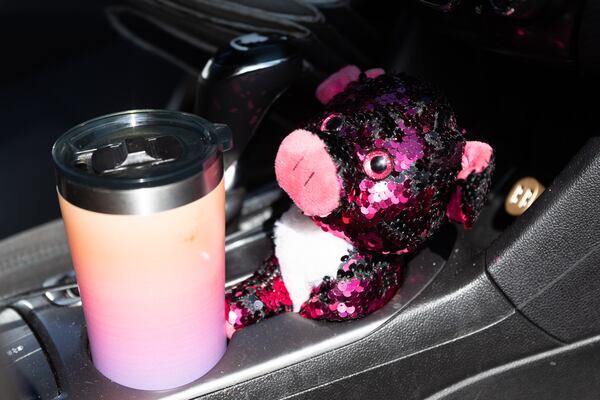 Shkayla Moore keeps a stuffed animal in her car in Stockbridge on Thursday, Sept. 7, 2023. The stuffed animal keeps her company when she is lonely, she said. The Marine Corps veteran spent much of the summer sleeping in parking lots in her car because she couldn't  find a place that would accept her housing voucher. (Arvin Temkar / arvin.temkar@ajc.com)