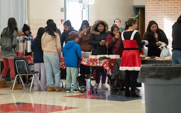 Over 1,000 immigrants facing food insecurity attended the event to receive food, clothing and other resources. Saturday, December 14, 2024 (Ben Hendren for the Atlanta Journal-Constitution)