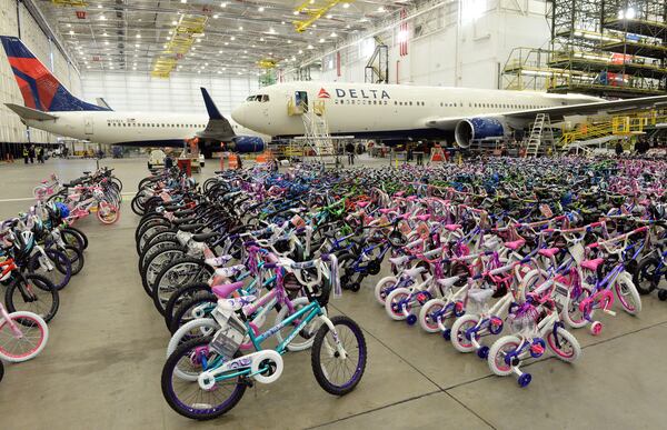 DECEMBER 4, 2015 ATLANTA Technicians at Delta's TechOps maintenance operation donated nearly 700 bikes (with helmets) to Marine Corps representatives Friday, December 4, 2015. Marine Corps Col Matt Puglisi, Commanding Officer, Combat Logistics Regiment 45, accepted the bikes, that were donated and assembled by Delta technicians, who work in 21 different shops, each specializing in an area like avionics, wheels and brakes, engines and airframes. There were also 2,500 toys donated. This is the 11th year TechOps has donated bicycles and toys. KENT D. JOHNSON/ kdjohnson@ajc.com