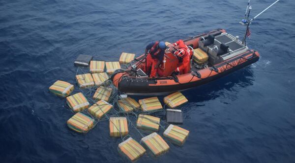 A Coast Guard Cutter Forward boatcrew recovers multiple bales of cocaine, which totaled approximately 2,535 pounds, Sunday, Dec. 2, 2018 nearly 69 miles southwest of Malpelo Island, Colombia. The bales were jettisoned from a suspected drug smuggling vessel with three suspected smugglers aboard.