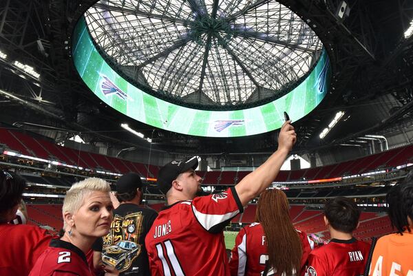 Atlanta Falcons fans walk through inside new Mercedes-Benz Stadium before an exhibition game against the Arizona Cardinals on Saturday, August 26, 2017. HYOSUB SHIN / HSHIN@AJC.COM