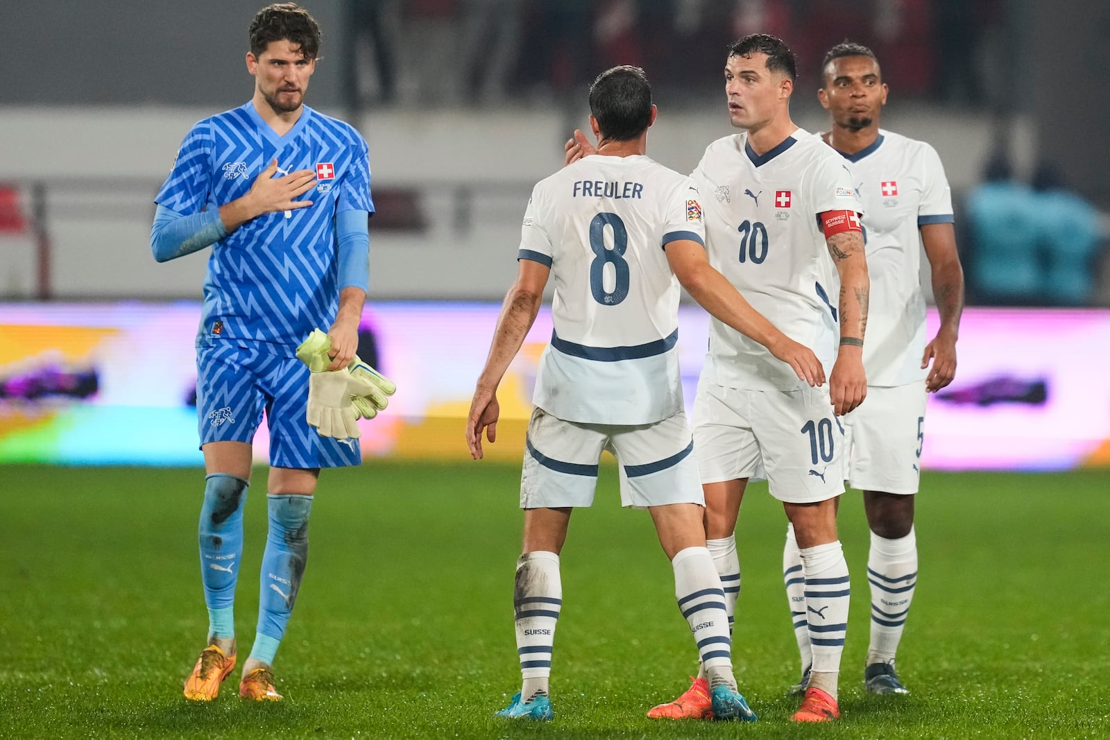 Switzerland's players leave the pitch after the UEFA Nations League soccer match between Serbia and Switzerland at the Dubocica Stadium in Leskovac, Serbia, Saturday, Oct. 12, 2024. (AP Photo/Darko Vojinovic)