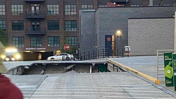 The collapse of the top floor of the Summerhill Station parking deck, which is anchored by a Publix Super Market, located on Hank Aaron Drive created a giant hole around 7 a.m. According to Branch Properties, which is the company that owns the retail complex, an “unauthorized person unaffiliated with ownership drove a crane truck onto the upper level of the deck past the weight-limit warning signs.”