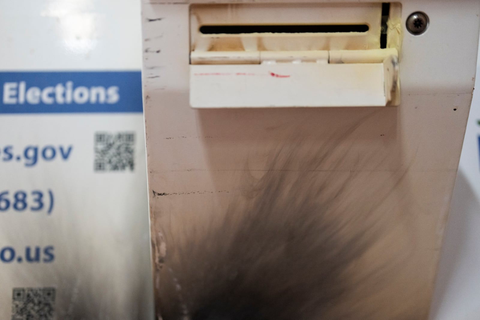 A damaged ballot drop box is displayed during a news conference at the Multnomah County Elections Division office on Monday, Oct. 28, 2024, in Portland, Ore. (AP Photo/Jenny Kane)