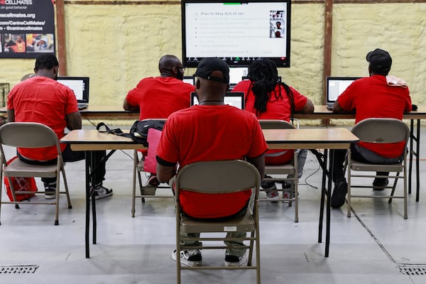 Participants in the Canine CellMates program attend one of their weekly classes.